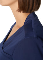 Load image into Gallery viewer, White Cross V-Tess 2-Pocket Jersey Knit Back V-Neck Scrub Top
